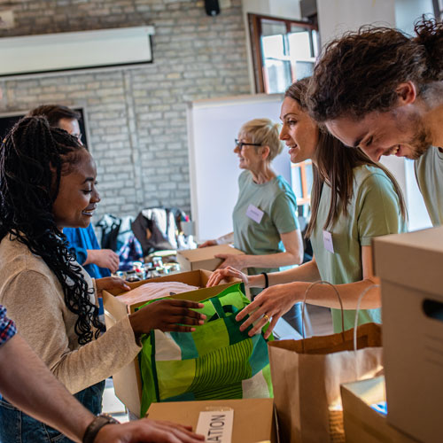 group of volunteers working to pack donations